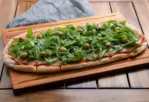 Pizza muzzarella con rúcula