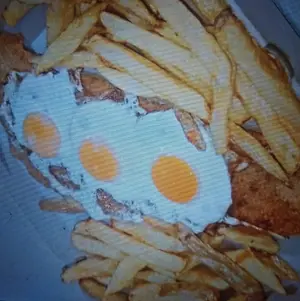 Milanesa a caballo con fritas
