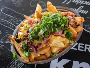 Porción papas fritas barcito
