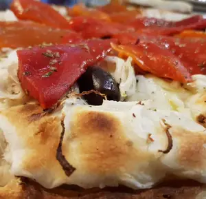 Pizza fuga rellena conmorrón g