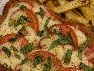 Milanesa capresse + papas