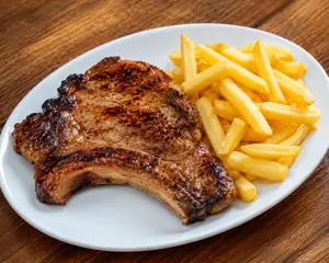 Bife ancho con guarnición