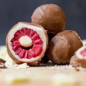 2 frambuesas bañadas en choco