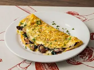 Omelette de queso champiñones