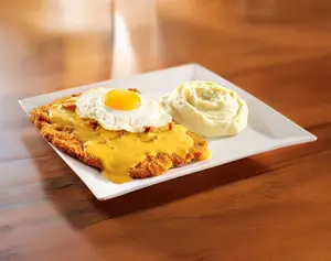 Milanesa cheddar, panceta y huevo