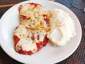 Milanesa napo con puré menu