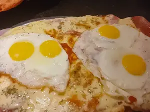 Milanesa muzza con huevos fritos p 1