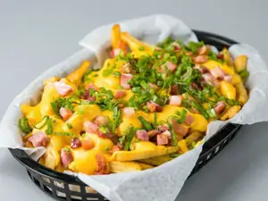 Porcion fritas cheddar panceta