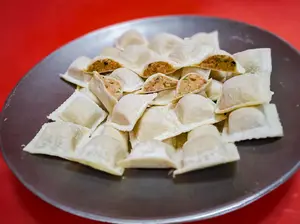 Raviolon panceta por plancha