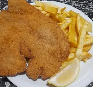 Milanesa de pollo con guarn.