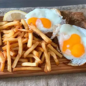 Milanesa a caballo con papas