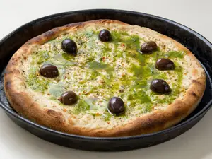 Pizza muzza y pesto de rúc veg