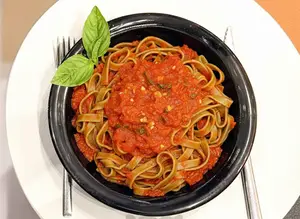 Fetuccinis de espinaca con fileto