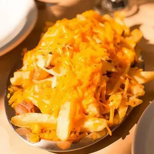 Papas fritas con cheddar