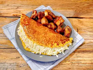 Cachapa con queso y cerdo.