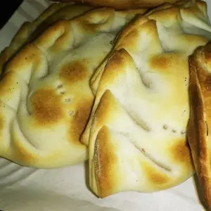 Empanada calabaza con salsa blanca a la crema