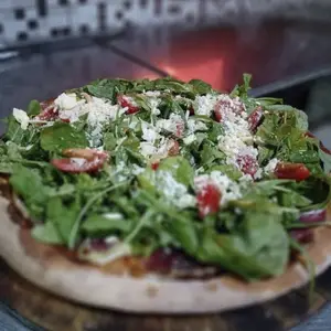 Pizza con rúcula