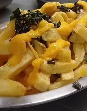 Porción de papas fritas toque