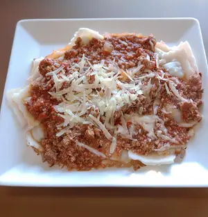 Ravioles Con Salsa Bolognesa