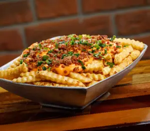 PAPAS FRITAS CHEDDAR Y BACON
