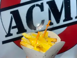 Papas fritas con cheddar