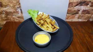 Papas fritas con cheddar