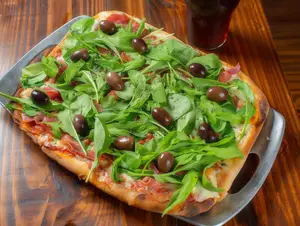 Pizza con rúcula y jamón crudo