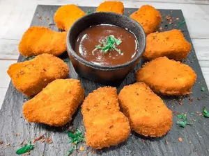 Nuggets extra crujiente + aderezo bbq