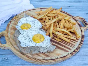 Milanesa a caballo compartir