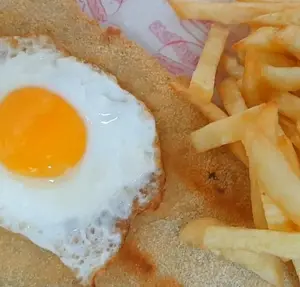 Milanesa De Ternera A Caballo Mas Guarnicion