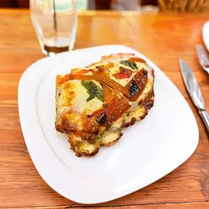 Porción pizza jamón y morrones
