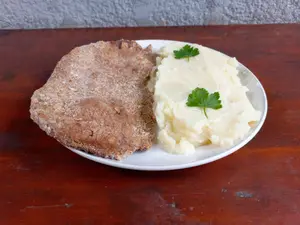 Milanesa al horno + guarnicion